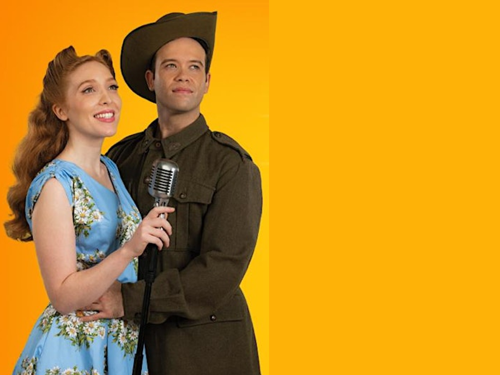 Man in Australian Army uniform, holding a women in blue floral dress with microphone, World War 2 time frame.