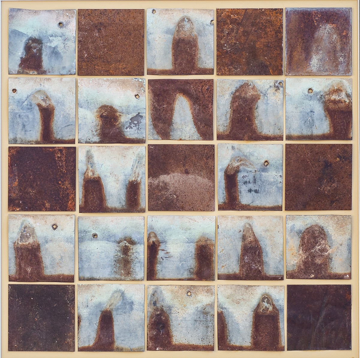 artwork featuring rusted metal small panels laid in a square formation